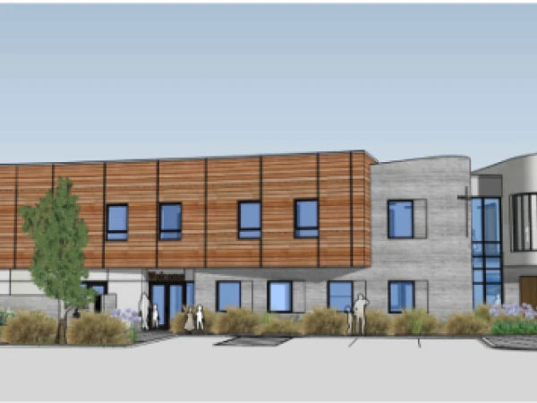 A vibrant and detailed rendering of the new preschool facility, showcasing a modern and welcoming design. The building features large windows that flood the interior with natural light, surrounded by lush green spaces.