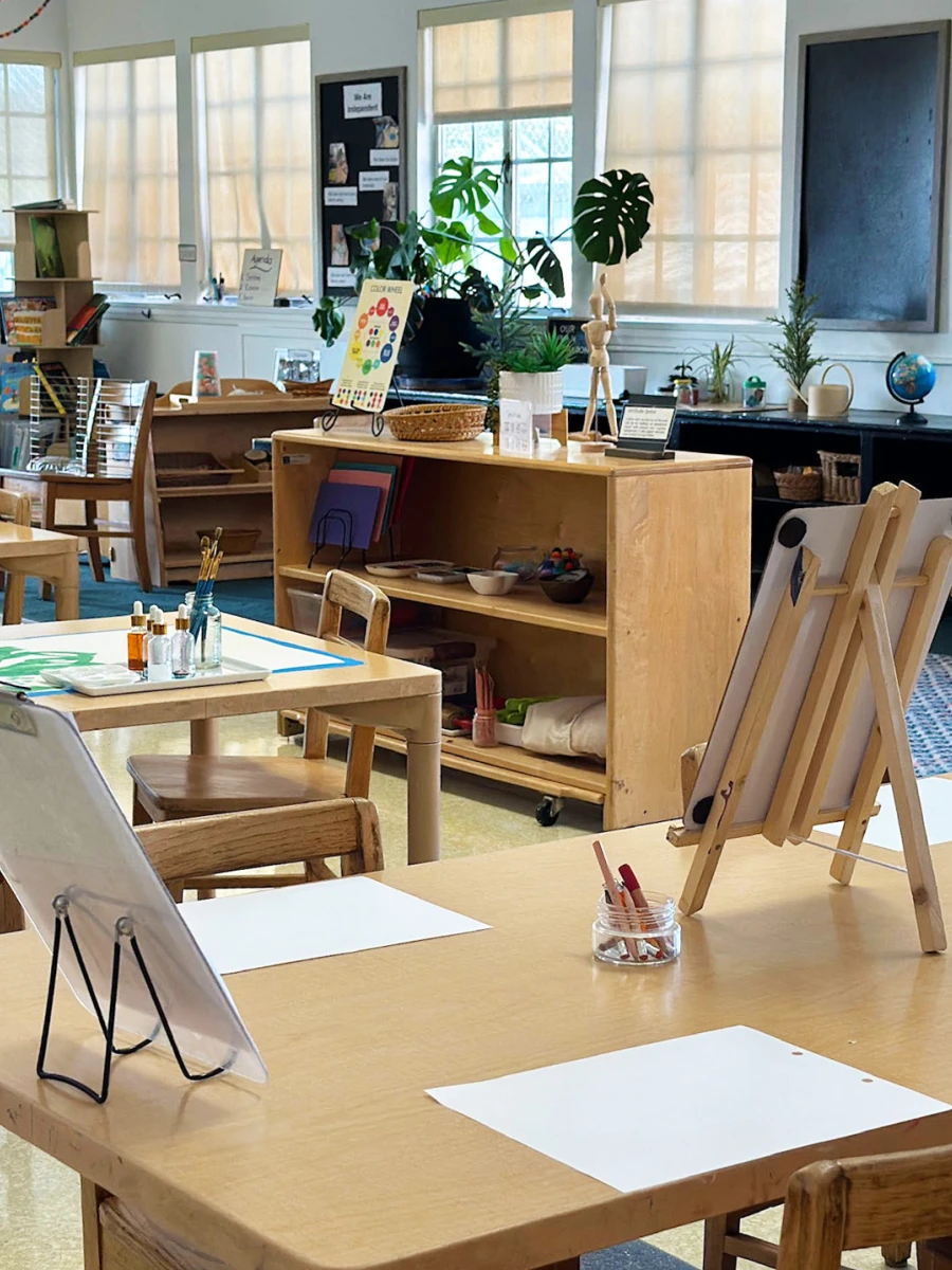 A light and airy classroom filled with an array of art materials, blocks, and other exciting resources, all ready for the children to explore and enjoy.